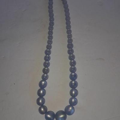 Three beaded necklaces one with matching bracelets
