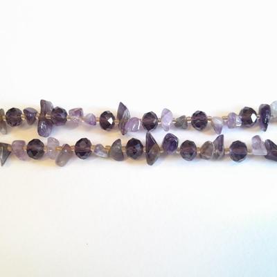 Three beaded necklaces one with matching bracelets