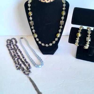 Three beaded necklaces one with matching bracelets