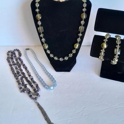 Three beaded necklaces one with matching bracelets