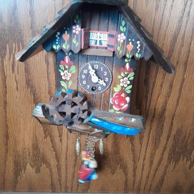 Antique wooden two-tiered table with faux clock music box