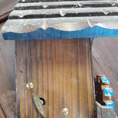 Antique wooden two-tiered table with faux clock music box