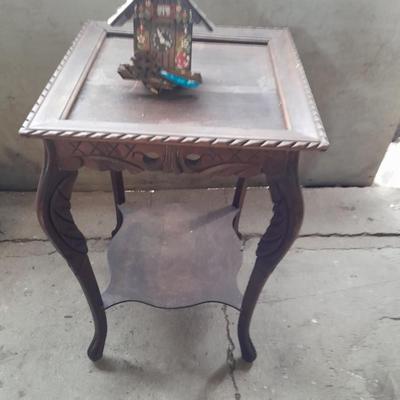 Antique wooden two-tiered table with faux clock music box
