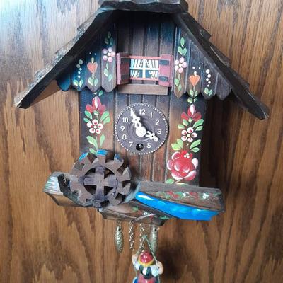 Antique wooden two-tiered table with faux clock music box