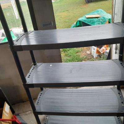Tall black plastic Storage shelving unit