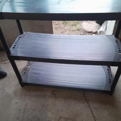 Tall black plastic Storage shelving unit