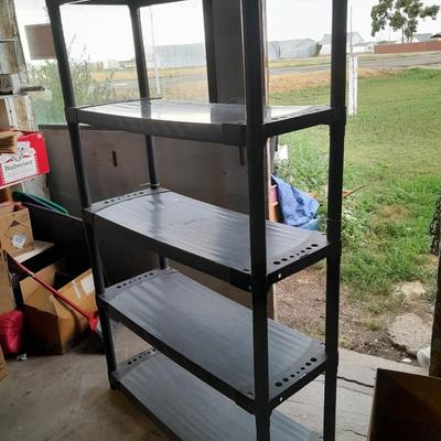 Tall black plastic Storage shelving unit