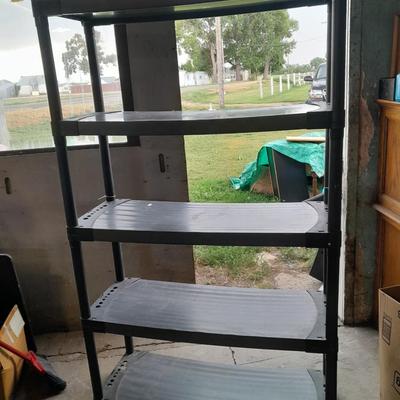 Tall black plastic Storage shelving unit