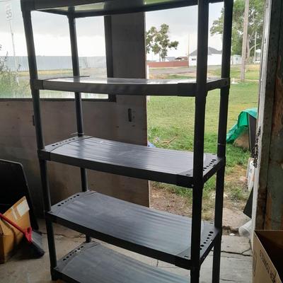 Tall black plastic Storage shelving unit