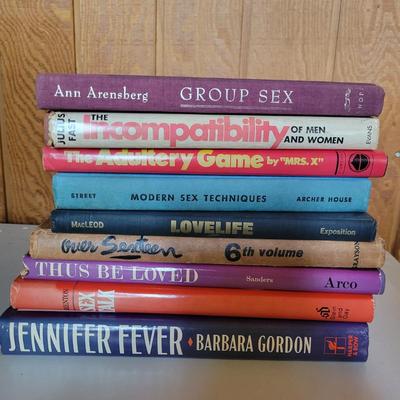 Assortment of RisquÃ© Adult Books and Glasses (O-DW)