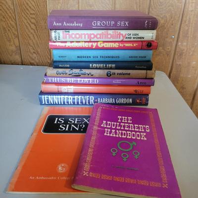 Assortment of RisquÃ© Adult Books and Glasses (O-DW)