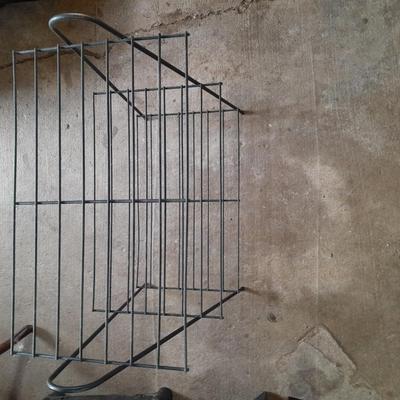 Black metal shelf and wall hanging wooden mirrored back display case.