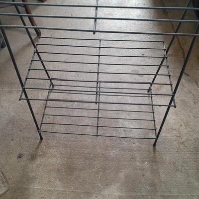 Black metal shelf and wall hanging wooden mirrored back display case.