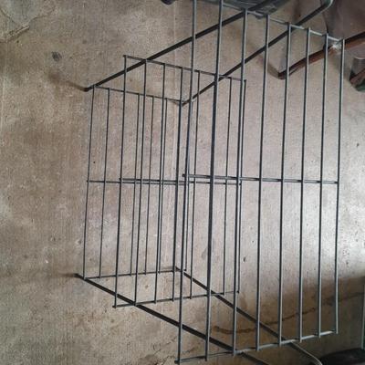 Black metal shelf and wall hanging wooden mirrored back display case.