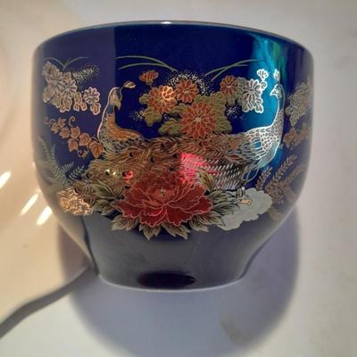 Avon bottles, vintage Paden City Pottery plate and peacock bowls