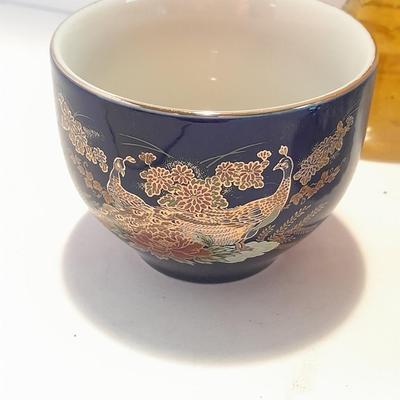 Avon bottles, vintage Paden City Pottery plate and peacock bowls