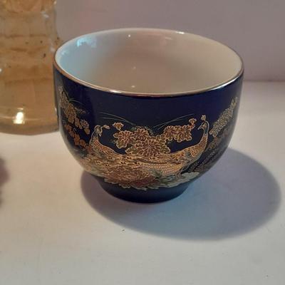 Avon bottles, vintage Paden City Pottery plate and peacock bowls