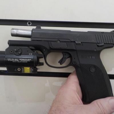 Ruger SR9 semi auto pistol, NEW with papers & lock case. Est. $300 to $600.