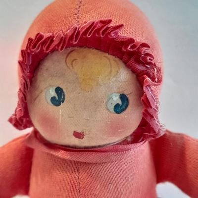 Plastic blonde doll with pig tails and Unknown brand Antique Kewpie like cloth with painted face doll