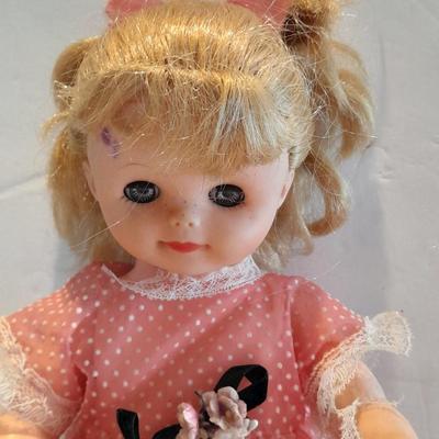 Plastic blonde doll with pig tails and Unknown brand Antique Kewpie like cloth with painted face doll