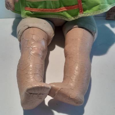Very old and well-loved composition and cloth baby doll