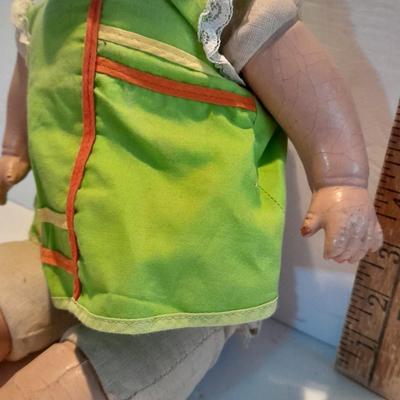 Very old and well-loved composition and cloth baby doll