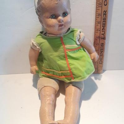 Very old and well-loved composition and cloth baby doll