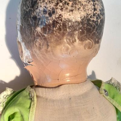 Very old and well-loved composition and cloth baby doll