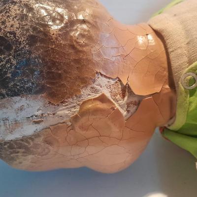 Very old and well-loved composition and cloth baby doll