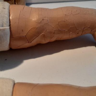 Very old and well-loved composition and cloth baby doll