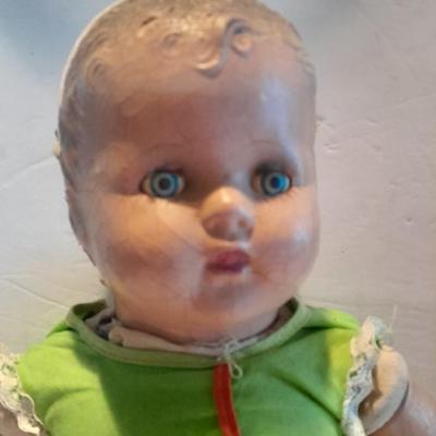 Very old and well-loved composition and cloth baby doll