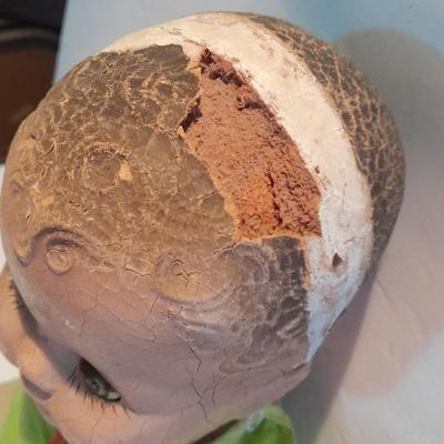 Very old and well-loved composition and cloth baby doll