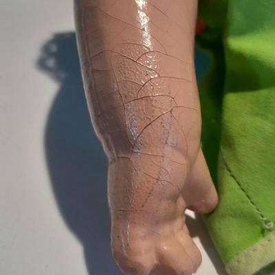 Very old and well-loved composition and cloth baby doll