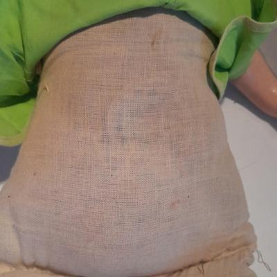 Very old and well-loved composition and cloth baby doll