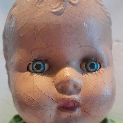 Very old and well-loved composition and cloth baby doll