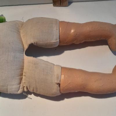 Very old and well-loved composition and cloth baby doll