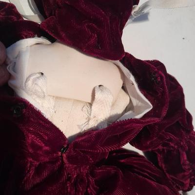 Three porcelain face and footed dolls Cloth bodied.