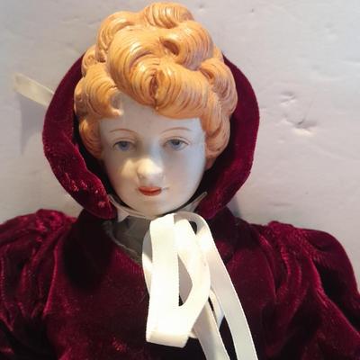 Three porcelain face and footed dolls Cloth bodied.