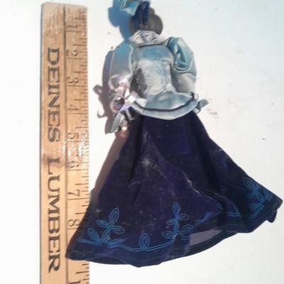 Three porcelain face and footed dolls Cloth bodied.