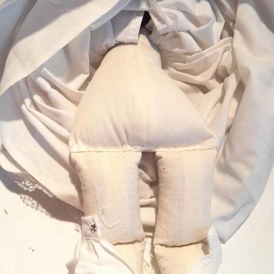 Three porcelain face and footed dolls Cloth bodied.