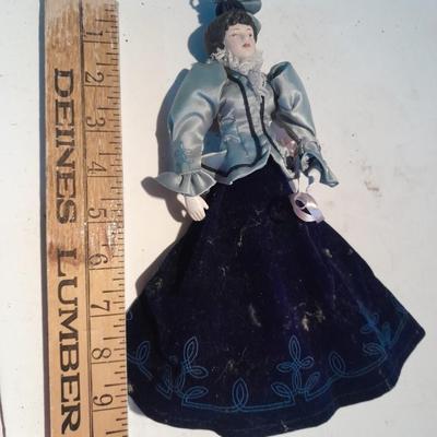 Three porcelain face and footed dolls Cloth bodied.