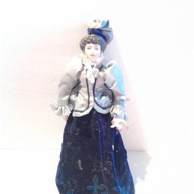 Three porcelain face and footed dolls Cloth bodied.