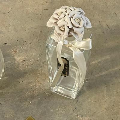 Two Vintage Perfume Bottles with Ceramic Flower Tops