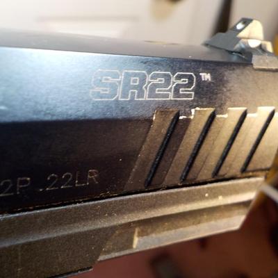 Ruger SR22 pistol with Magazine. est.$150 to $400.