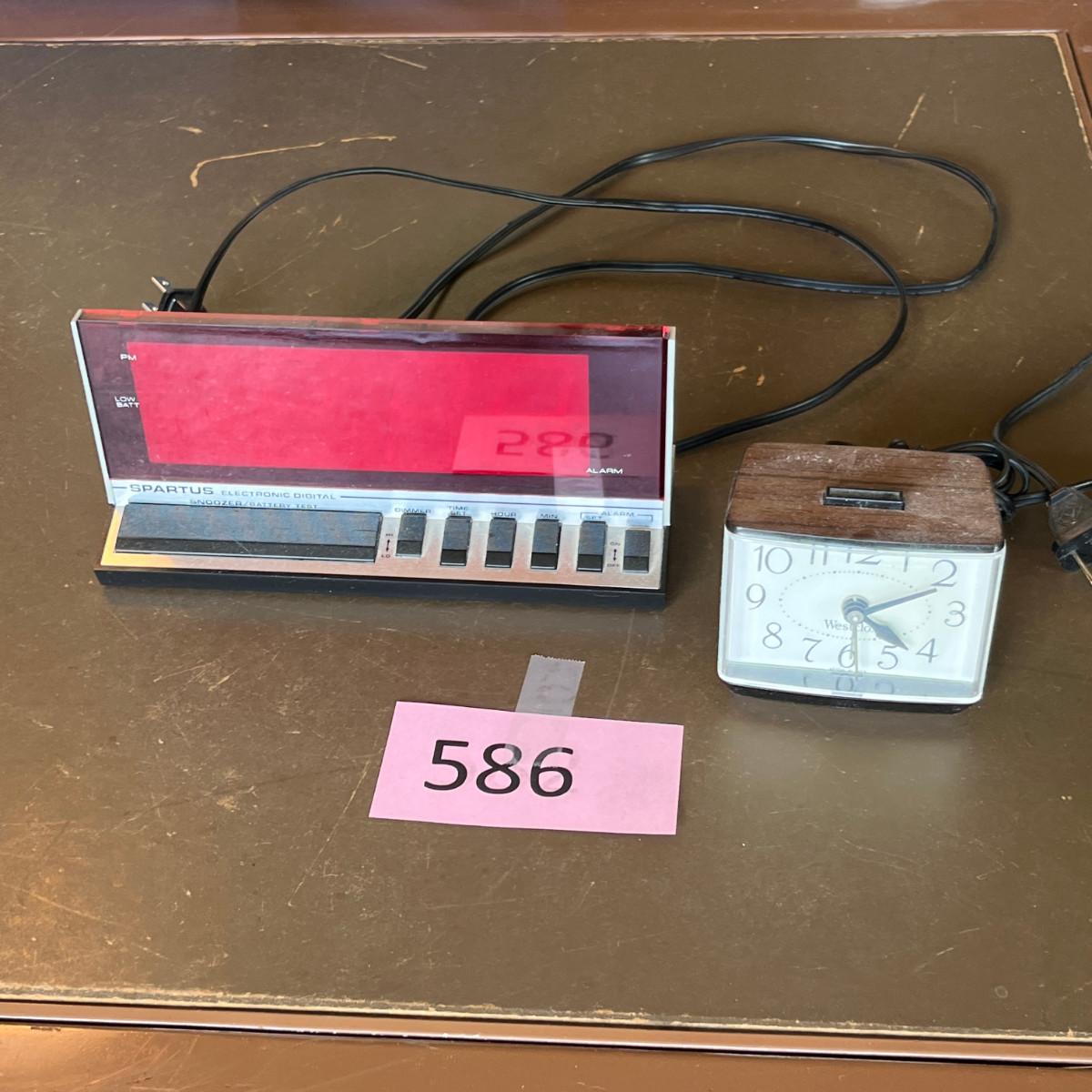 Two electric alarm clocks