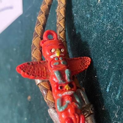 Vintage Red Celluloid Totem Pole on Bolo