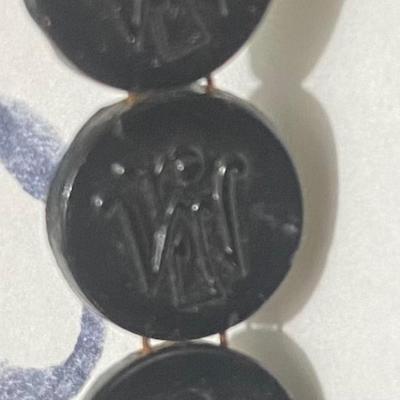 Not sure.  Think they are glass?