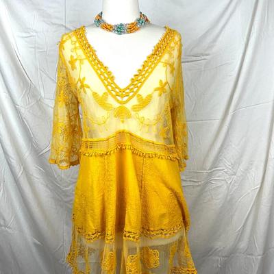 113 Yellow Lace Pullover with Beaded Necklace and Floral Sunhat