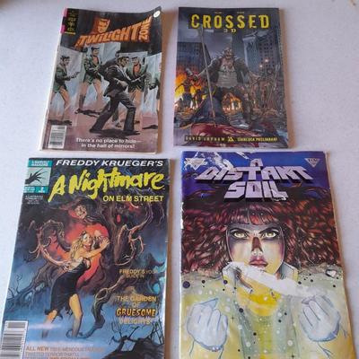 Horror Comic books and other books Crossed 3D, Nightmare on Elm Street, Distant Soh, and Twilight zone.
