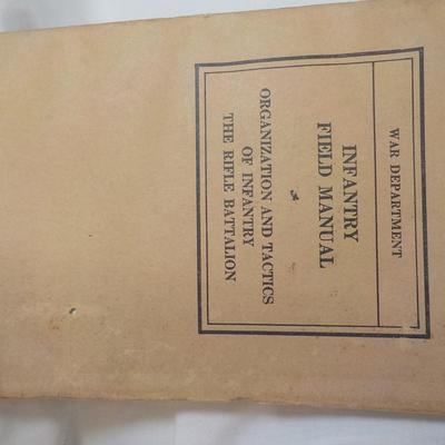 WW1 and WW2 Combat Training Books and a Display Grenade (Empty) est. $25 to$55.
